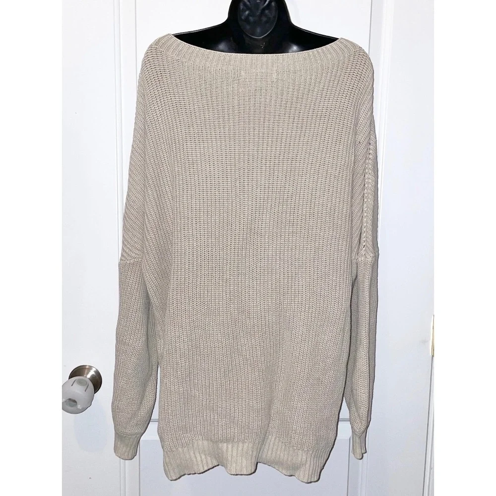 Mazik textured knit sweater features a soft beige/ivory color and a relaxed fit